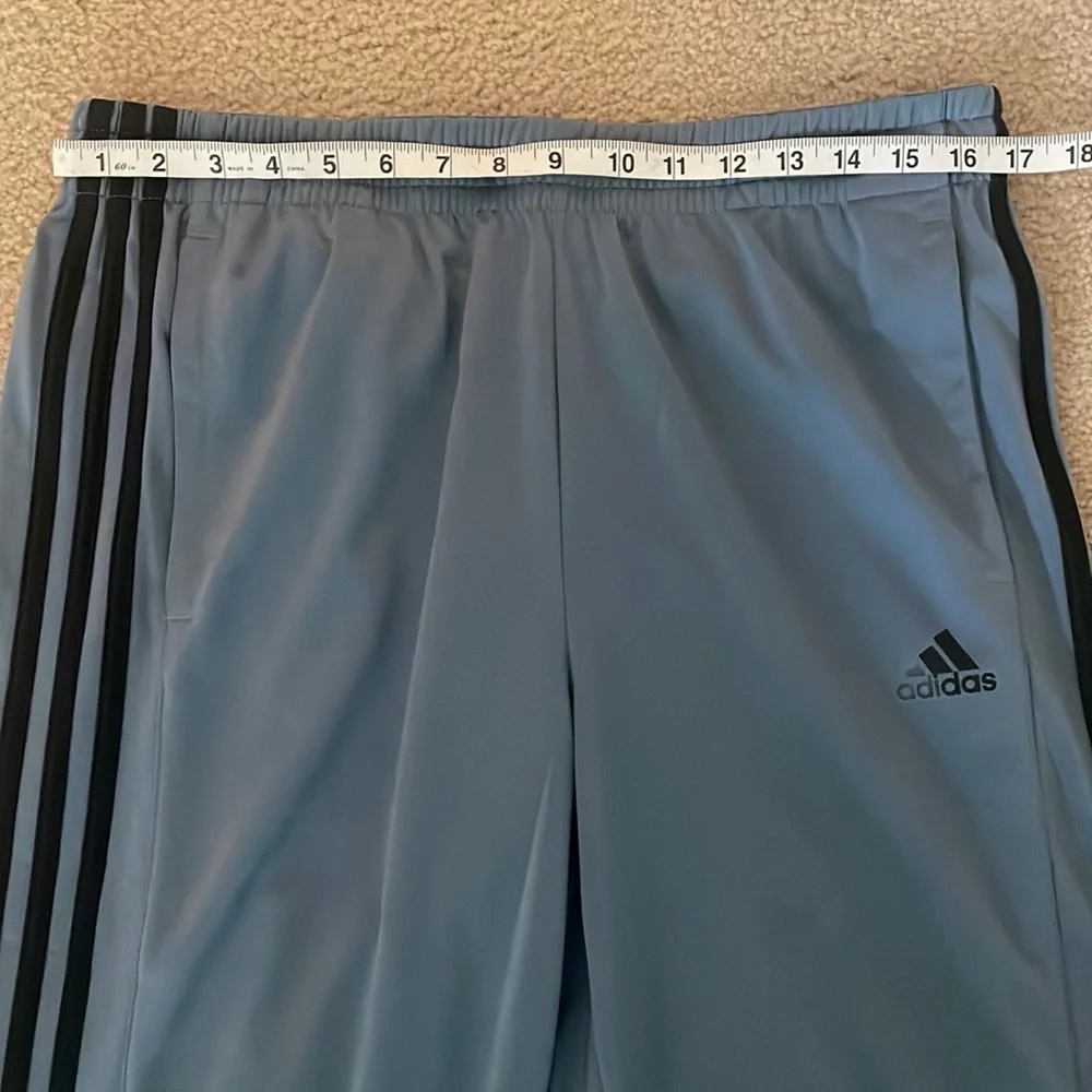 Adidas Men’s Joggers. Blue/grey color with black stripes.
